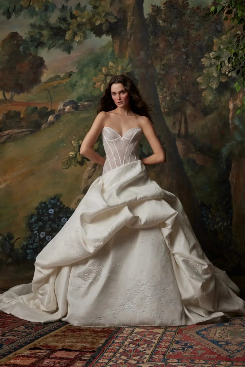 Model wearing a white dress by Pnina Tornai