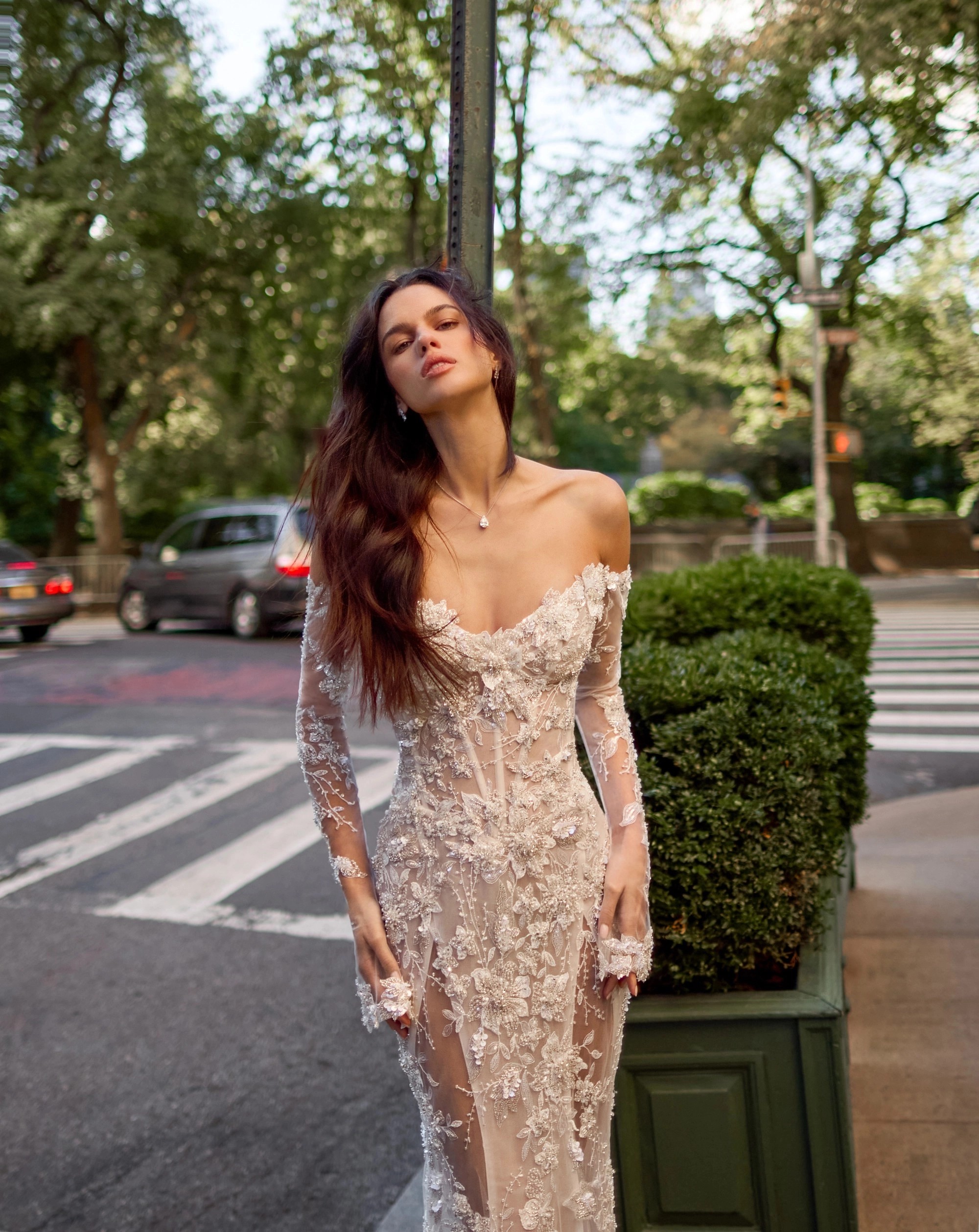 Model wearing a white dress by Pnina Tornai