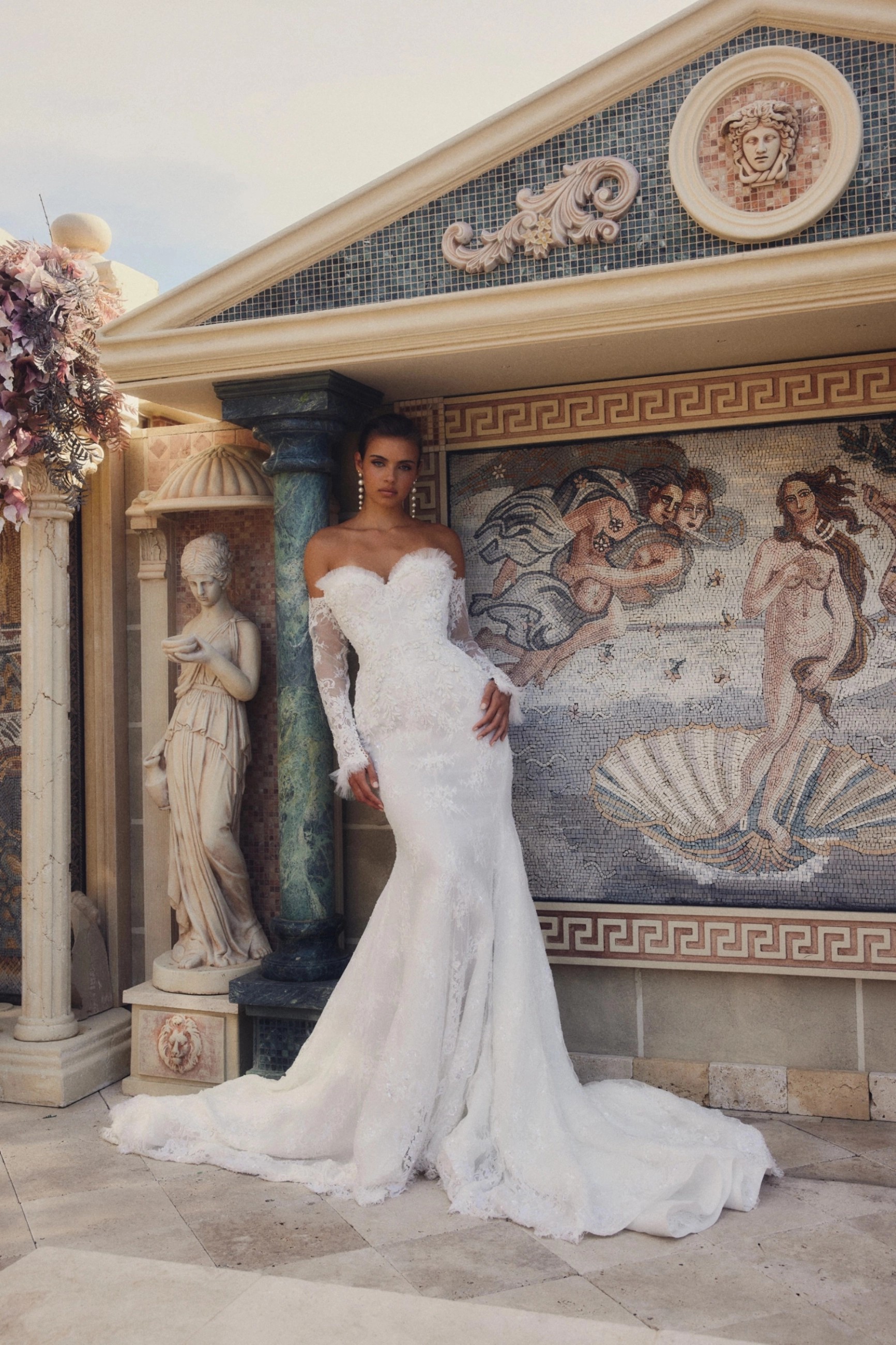 Model wearing a white dress by Leah Da Gloria