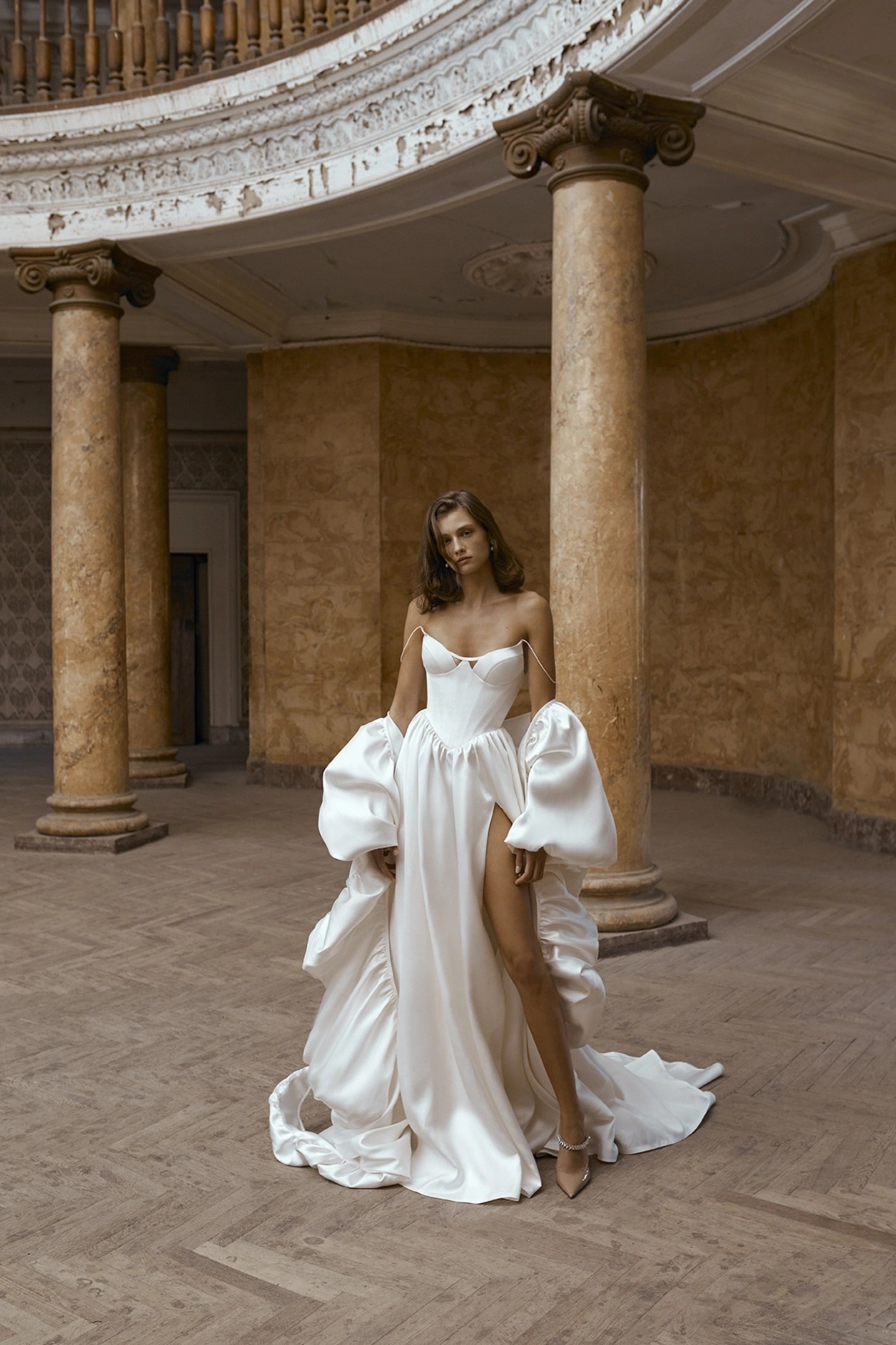 Model wearing a white dress by Alon Livne